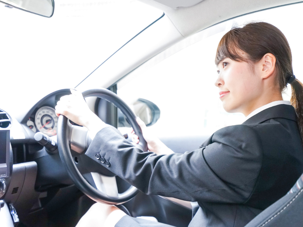 women driving a hired van