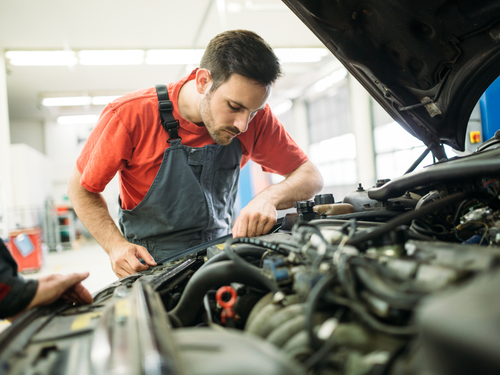 mechanic checks car from inside